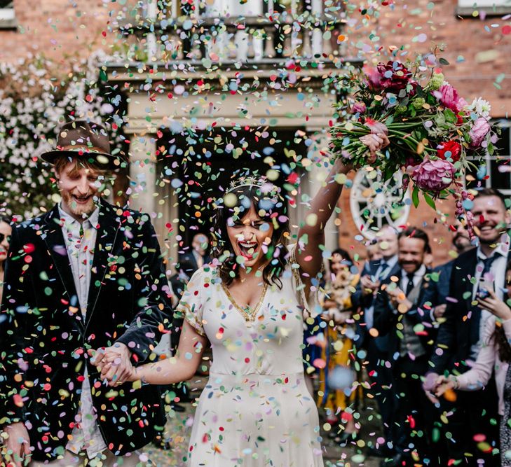 Colourful Confetti Moment with Bride in Vintage Wedding Dress and Crown and Groom in Velvet Blazer and Hat-065