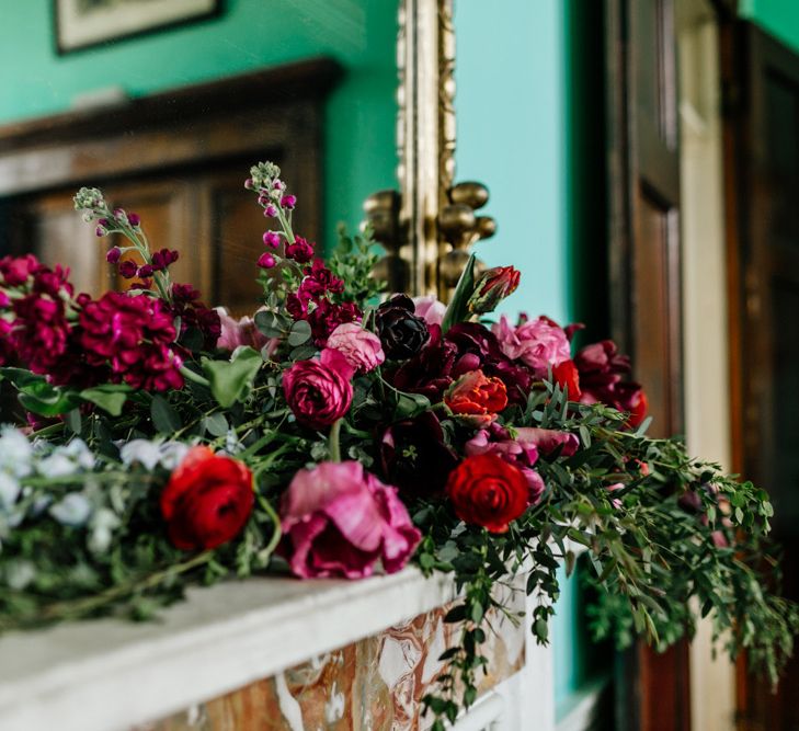 Deep Red and Pink Floral Arrangement with Foliage