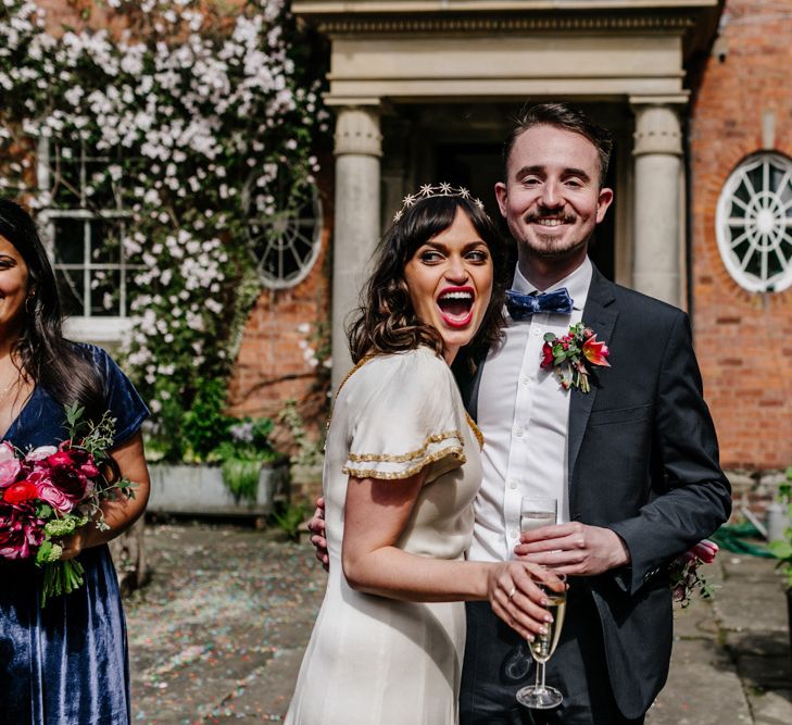 Bride in Vintage Wedding Dress and Crown with Her Bridesman in Bow Tie