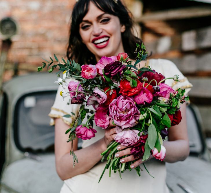 Deep Pink and Red Wedding Bouquet with Foliage