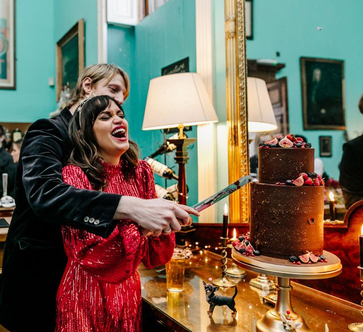 Bride and Groom Cutting the Chocolate Wedding Cake