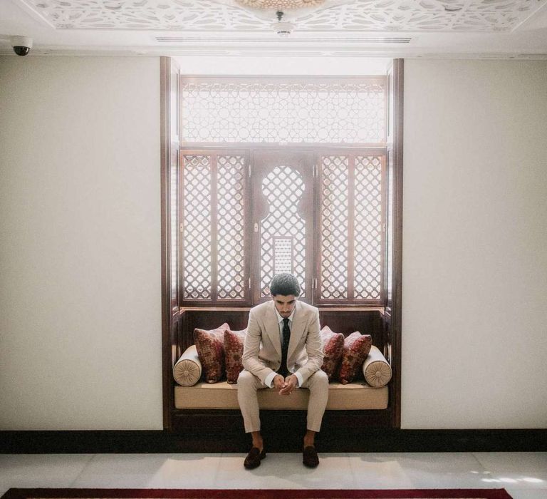 Groom in cream suit