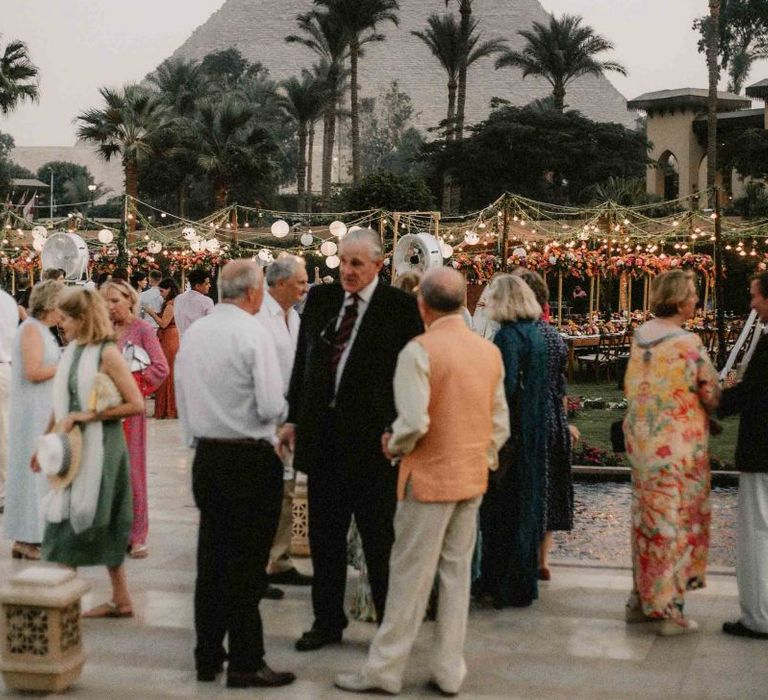 Guests enjoy drinks at destination wedding