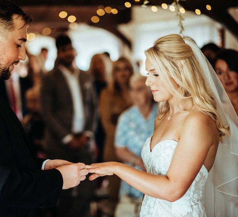 Bride and groom during barn wedding