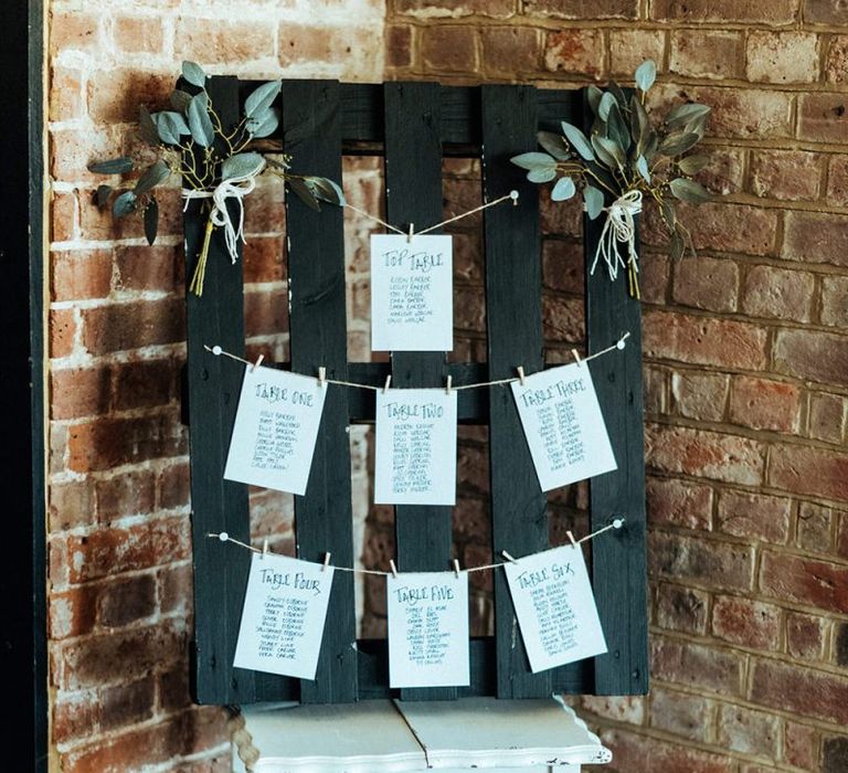 Rustic wedding table plan at Long Furlong Barn