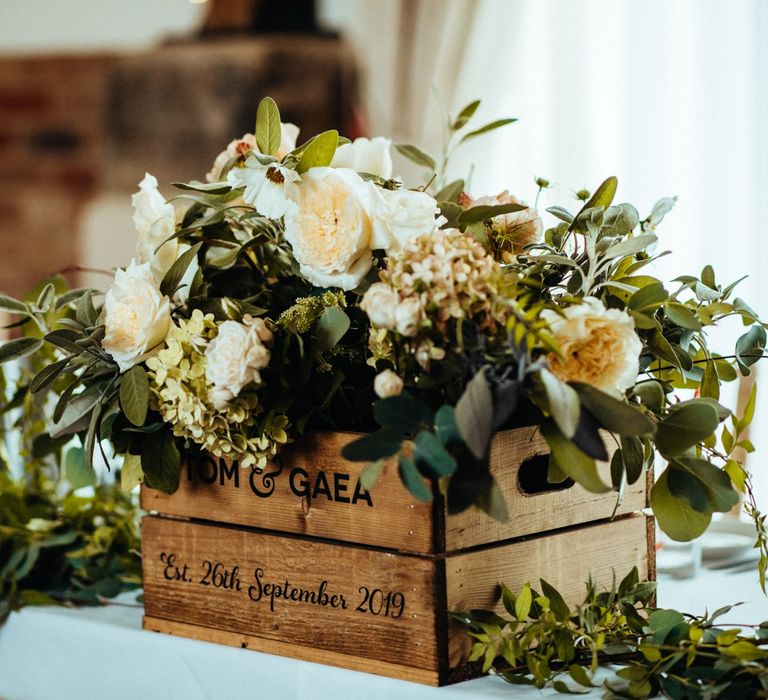 Rustic wedding flowers in wooden crate