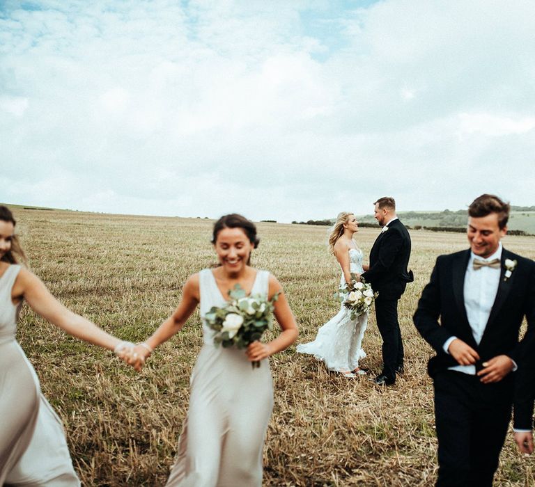 Groomsmen in tuxedos for rustic wedding