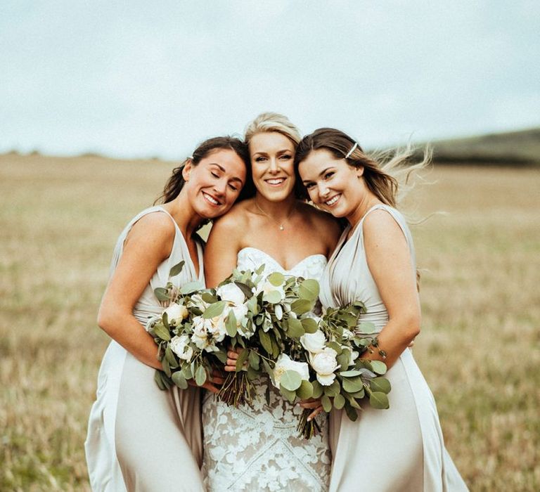 Champagne bridesmaid dresses with white bouquets