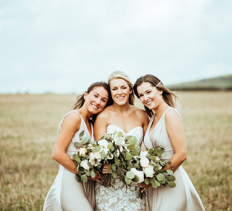 Champagne bridesmaid dresses with white bouquets