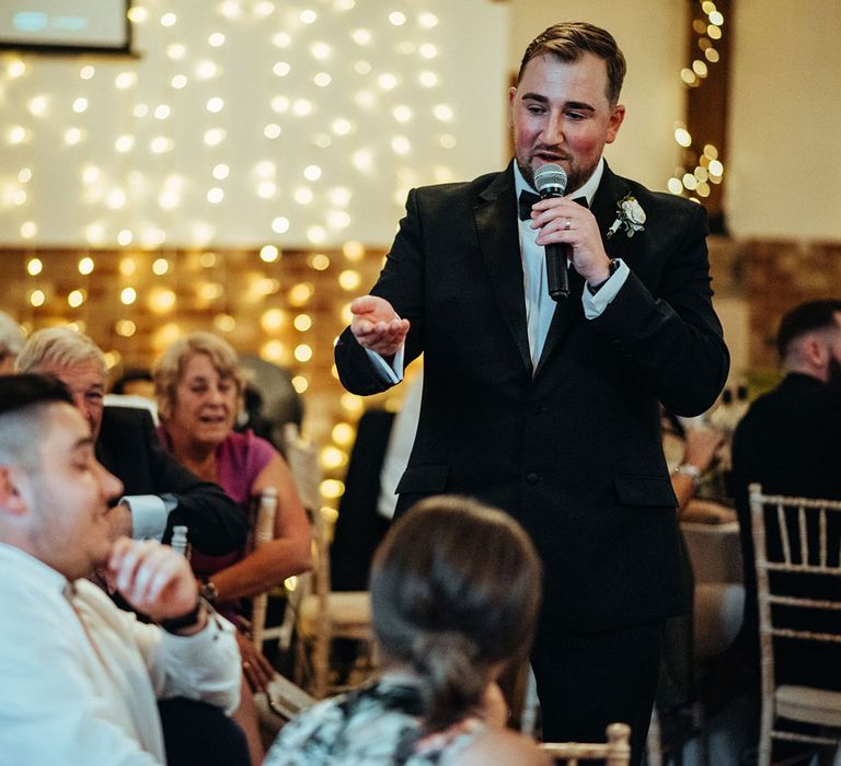 Fairy light backdrop for groom wedding speech