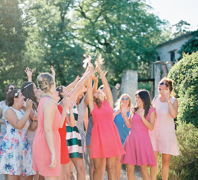 Throwing The Bouquet | Outdoor Wedding at Commanderie de Peyrassol, Provence, France Styled by La Chuchoteuse | Lace Bridal Gown | Black Tie Suit | Rustic Stretch Tent Reception | Raisa Zwart Photography