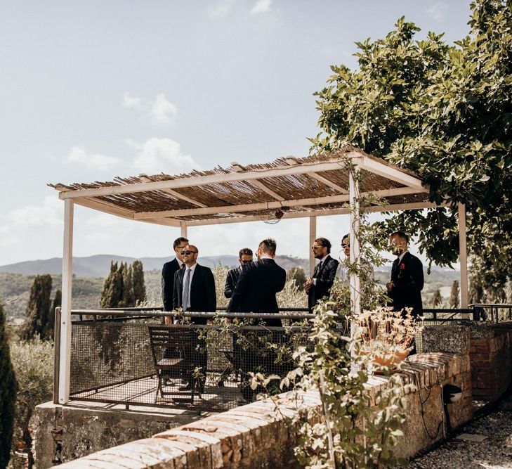 Groom prepares for Italian wedding ceremony