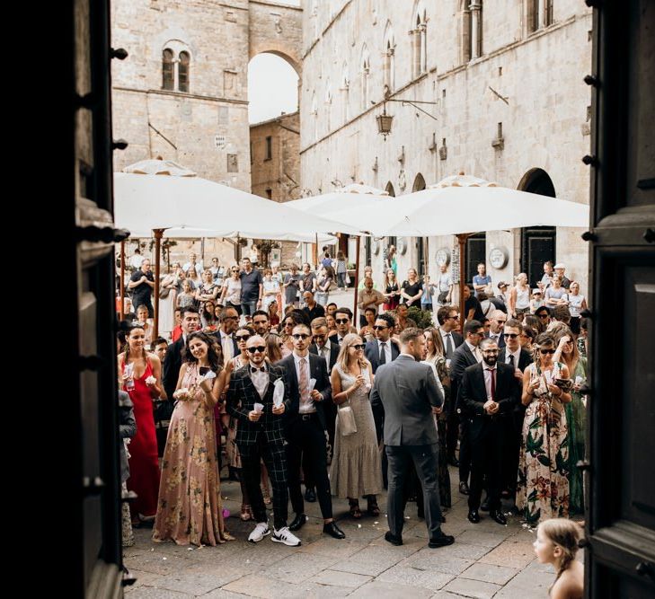 Guests watch bride and groom get married