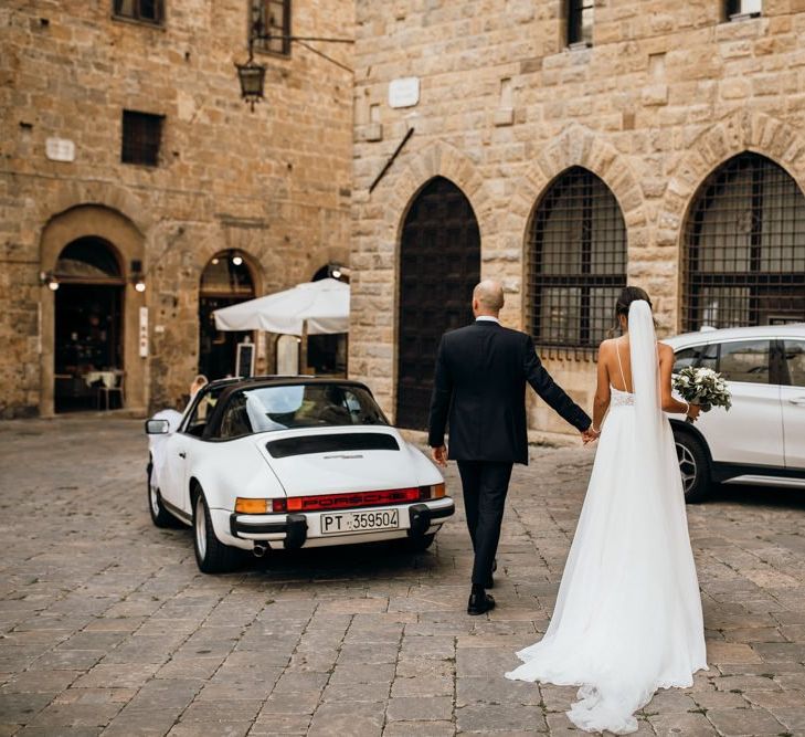 Italian wedding with Justin Alexander wedding dress with white Porsche wedding car