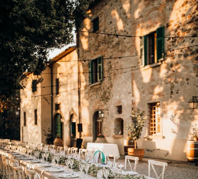 Stunning wedding table set up at Tuscan villa with foliage table runners