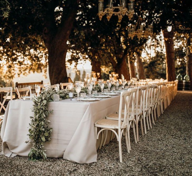 Stunning wedding table set up at Tuscan villa with foliage table runners