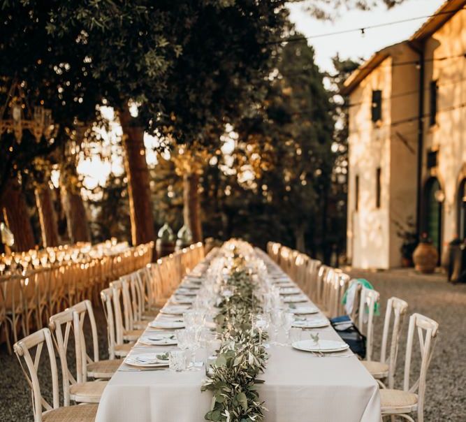 Stunning wedding table set up for Italian destination wedding with foliage table runners