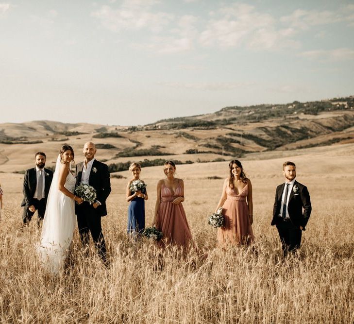 Bride with bridal party in pink bridesmaid dresses and groomsmen at Italian wedding