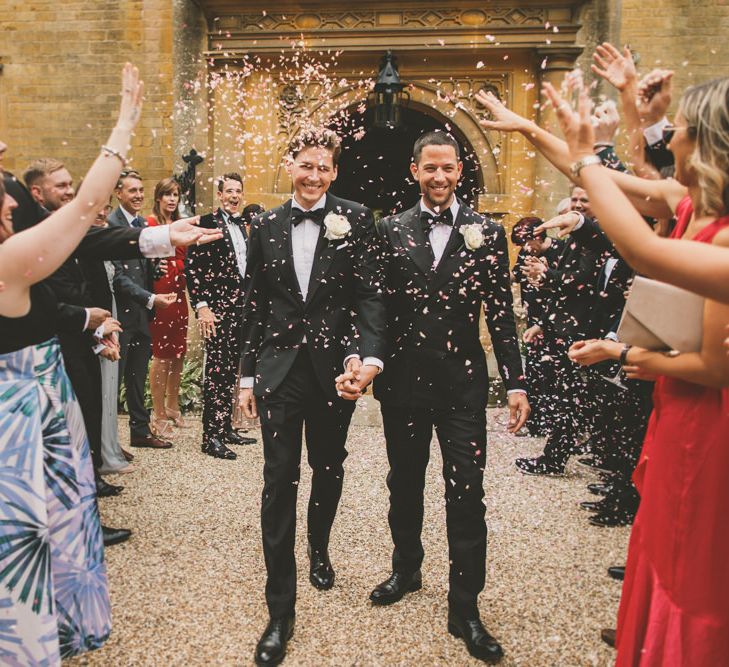 Confetti moment at Foxhill Manor with Grooms in black-tie suits