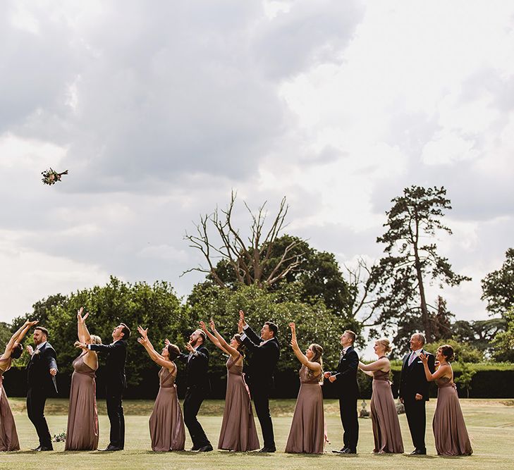 Bouquet Toss // Geometric Details &amp; Hanging Foliage For Hengrave Hall Wedding With Outdoor Reception With Images From Sam And Louise Photography