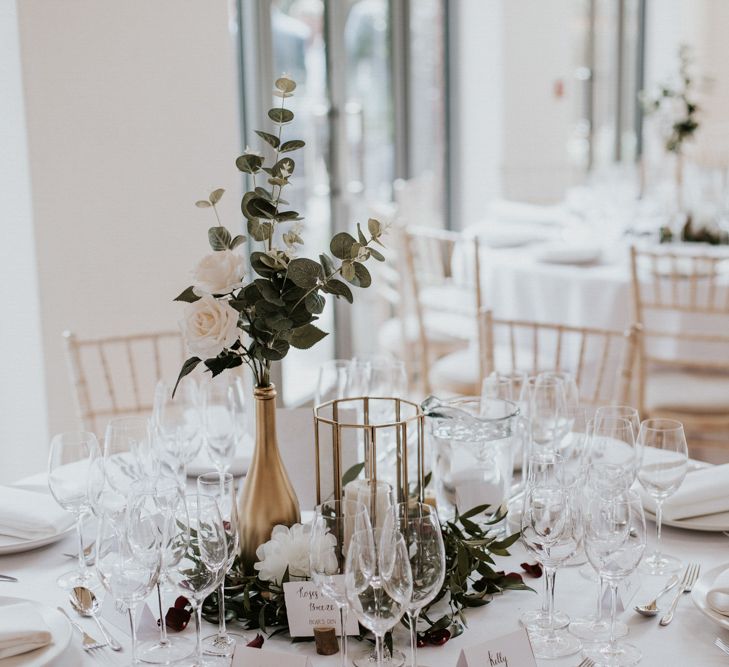 Gold Vase Centrepiece with White &amp; Green Flower Stems | Millbridge Court, Surrey Wedding with DIY Decor, Foliage &amp; Giant Balloons | Nataly J Photography