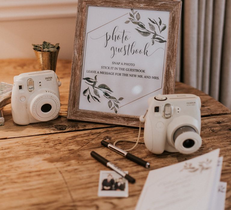 Polaroid Guest Book Station | Millbridge Court, Surrey Wedding with DIY Decor, Foliage &amp; Giant Balloons | Nataly J Photography