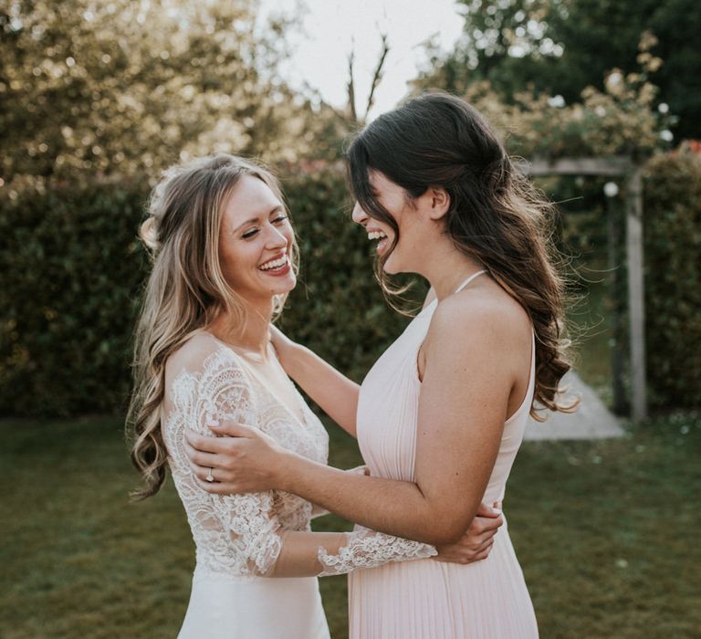 Bridesmaid in Pink Pleated Dress | Bride in Madison James Bridal Gown | Millbridge Court, Surrey Wedding with DIY Decor, Foliage &amp; Giant Balloons | Nataly J Photography