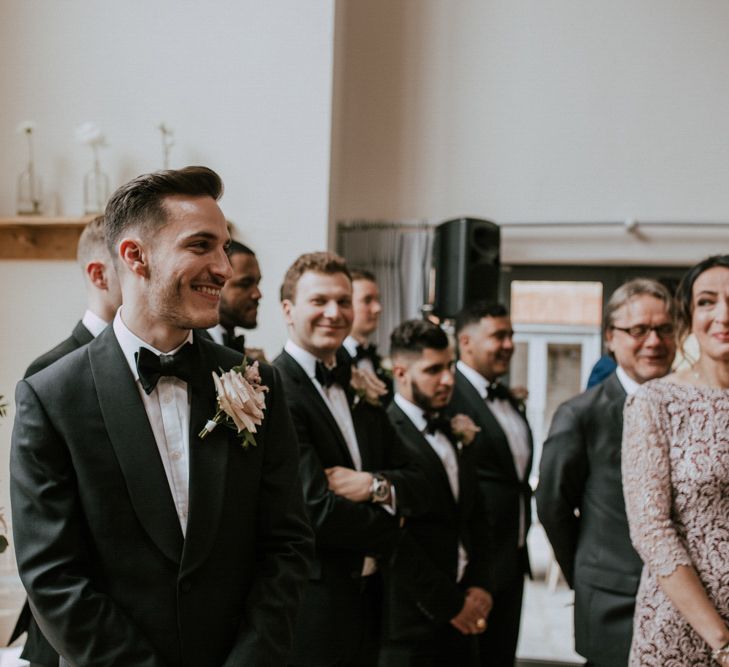 Groom at the Altar in Black Tie Suit | Millbridge Court, Surrey Wedding with DIY Decor, Foliage &amp; Giant Balloons | Nataly J Photography