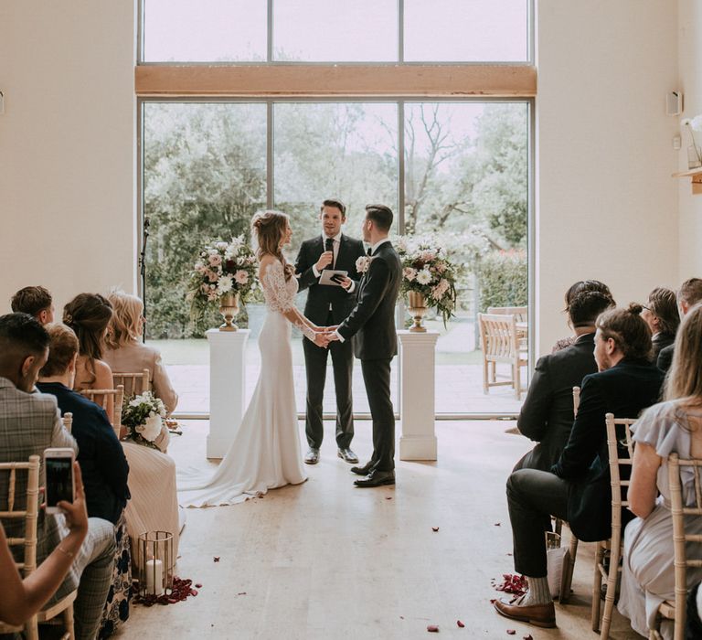 Wedding Ceremony Vows | Bride in Madison James Bridal Gown | Groom in Tuxedo | Millbridge Court, Surrey Wedding with DIY Decor, Foliage &amp; Giant Balloons | Nataly J Photography