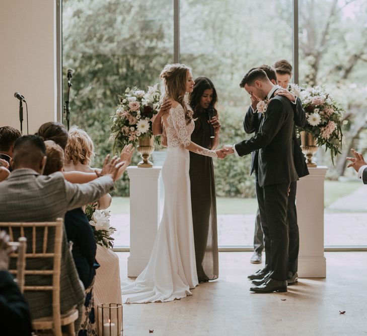 Wedding Ceremony | Personalised Vows | Bride in Madison James Bridal Gown | Groom in Tuxedo | Millbridge Court, Surrey Wedding with DIY Decor, Foliage &amp; Giant Balloons | Nataly J Photography