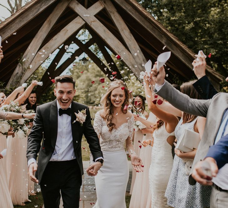 Confetti Moment | Bride in Madison James Bridal Gown | Groom in Tuxedo | Millbridge Court, Surrey Wedding with DIY Decor, Foliage &amp; Giant Balloons | Nataly J Photography