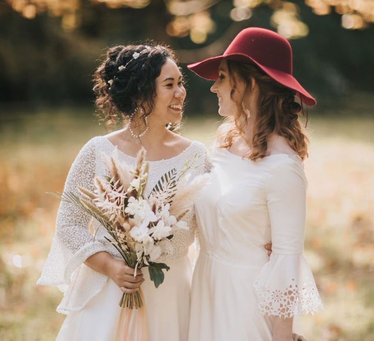 Same Sex Wedding with Brides in Bell Sleeve Wedding Dresses