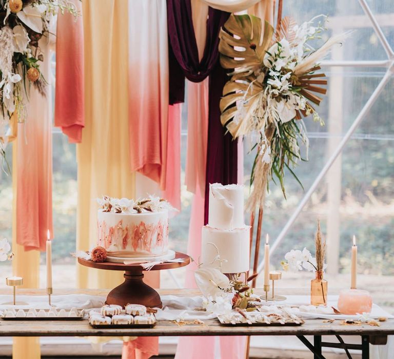 Dessert Table with Wedding Cakes, Doughnuts and Biscuits in Geometric Dome