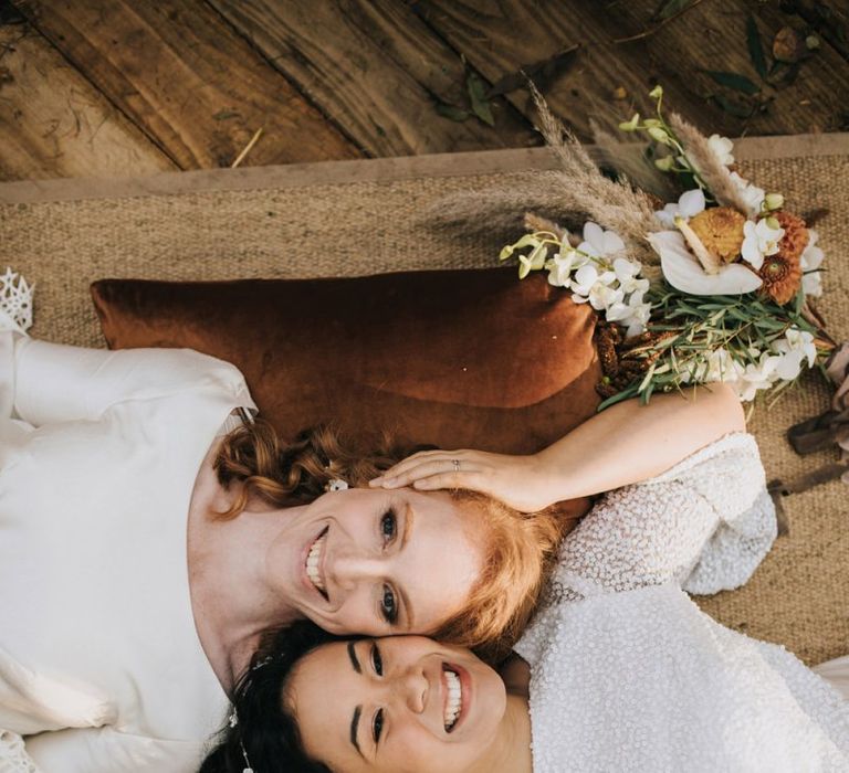 Same Sex Wedding Couple Laying on the Floor