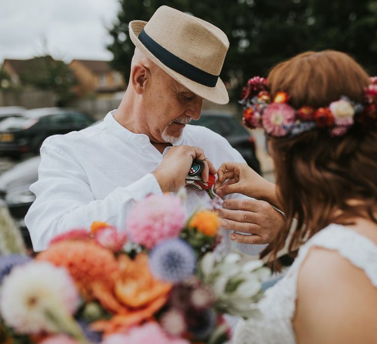 Father of the Bride in Fedora Hat Putting on a Buttonhole