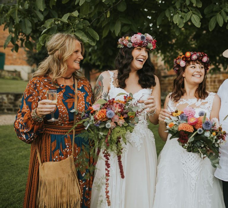 Same Sex Wedding Couple with Mother and Father of the Bride