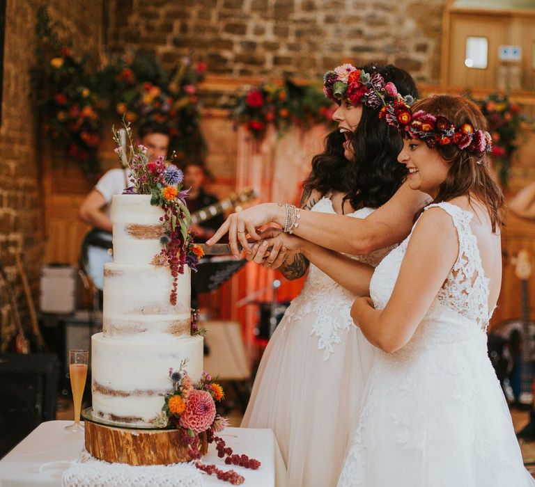 Two Brides Cutting Their Rustic Wedding Cake