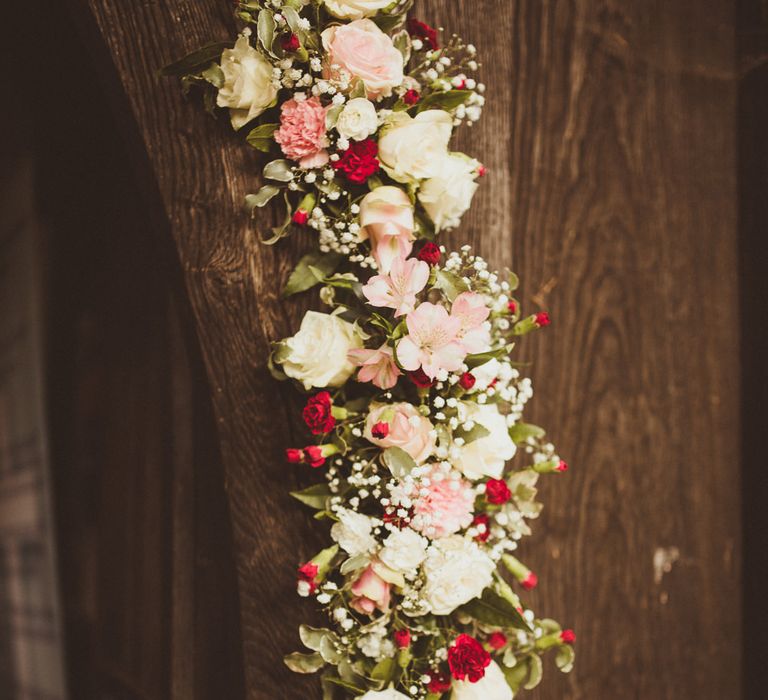 Church Burgundy, Pink &amp; White Floral Arch Flowers | Burgundy &amp; Gold Winter Wedding at Ramster Hall Weddings, Surrey | Matt Penberthy Photography | John Harris Wedding Films