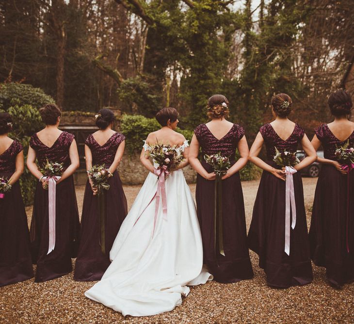 Bridesmaids in Coast Burgundy Separates | Bride in Lillian West Bridal Separates | Burgundy &amp; Gold Winter Wedding at Ramster Hall Weddings, Surrey | Matt Penberthy Photography | John Harris Wedding Films