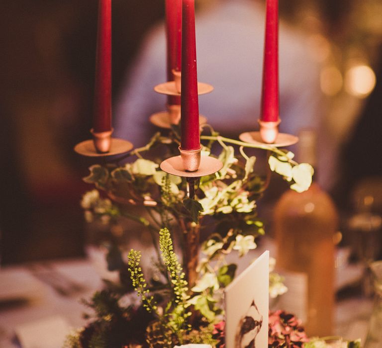 Candelabra with Tapper Candles | Burgundy &amp; Gold Winter Wedding at Ramster Hall Weddings, Surrey | Matt Penberthy Photography | John Harris Wedding Films