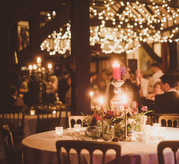 String Lights Wedding Reception Decor | Burgundy &amp; Gold Winter Wedding at Ramster Hall Weddings, Surrey | Matt Penberthy Photography | John Harris Wedding Films