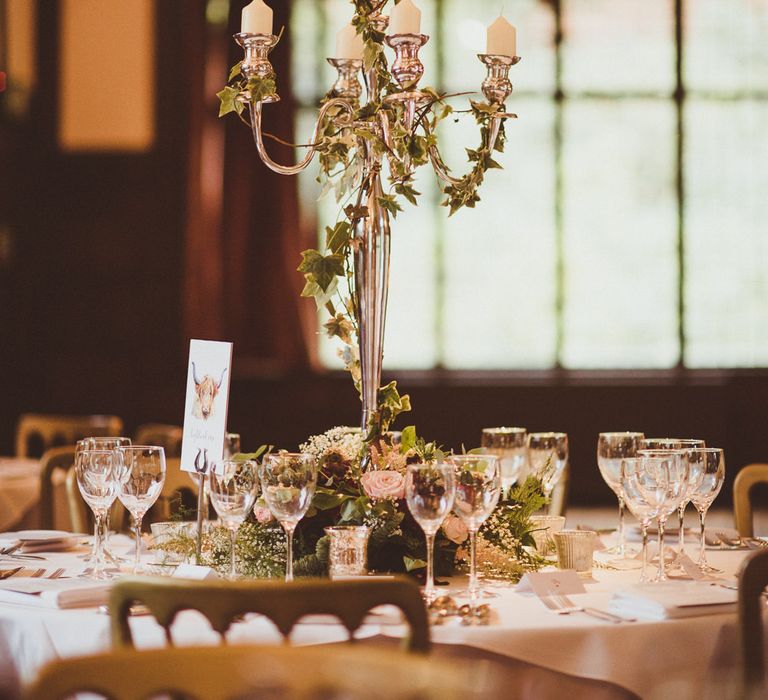 Candelabra Centrepiece | Burgundy &amp; Gold Winter Wedding at Ramster Hall Weddings, Surrey | Matt Penberthy Photography | John Harris Wedding Films