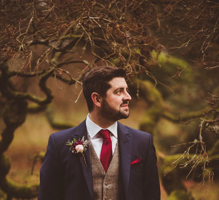 Groom in Navy Suit &amp; Tweed Waistcoat | Burgundy &amp; Gold Winter Wedding at Ramster Hall Weddings, Surrey | Matt Penberthy Photography | John Harris Wedding Films