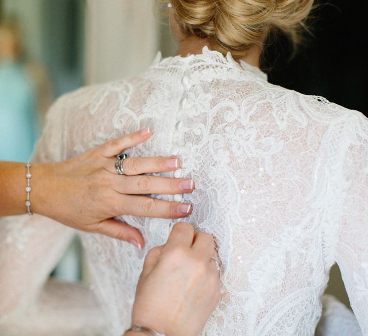 Button detail on dress | Papakata Sperry Tent Wedding at family home | Sassi Holford Dress with added ivory Ostrich feathers to veil | Manolo Blahnik shoes | Images by Melissa Beattie