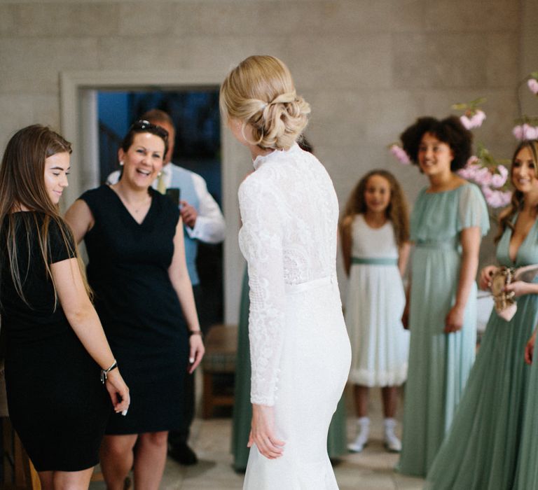 Papakata Sperry Tent Wedding at family home | Sassi Holford Dress with added ivory Ostrich feathers to veil | Manolo Blahnik shoes | Images by Melissa Beattie