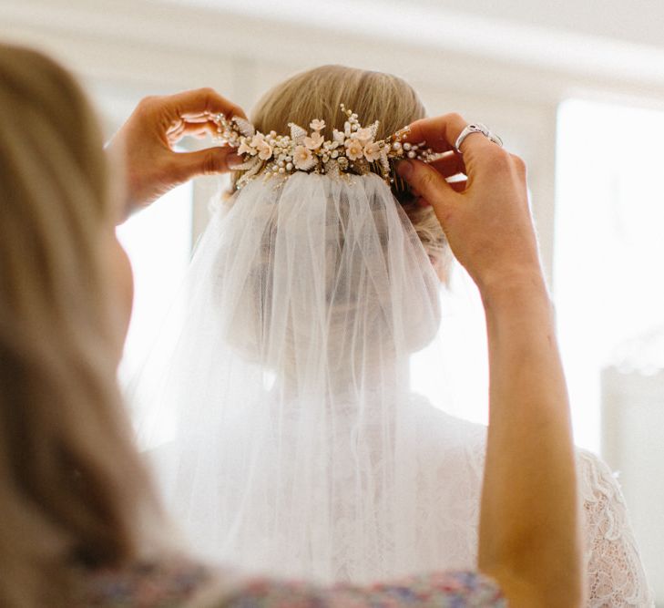 Hair comb and low loose up do for Bride | Papakata Sperry Tent Wedding at family home | Sassi Holford Dress with added ivory Ostrich feathers to veil | Manolo Blahnik shoes | Images by Melissa Beattie