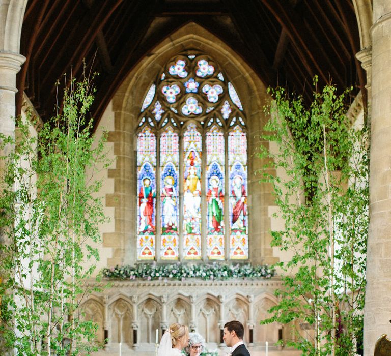 Lilac and white floral aisle runner | Silver Birch trees | Papakata Sperry Tent Wedding at family home | Sassi Holford Dress with added ivory Ostrich feathers to veil | Manolo Blahnik shoes | Images by Melissa Beattie