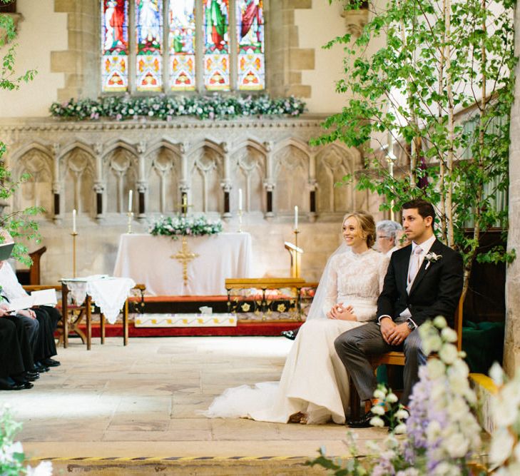 Lilac and white floral aisle runner | Silver Birch trees | Papakata Sperry Tent Wedding at family home | Sassi Holford Dress with added ivory Ostrich feathers to veil | Manolo Blahnik shoes | Images by Melissa Beattie