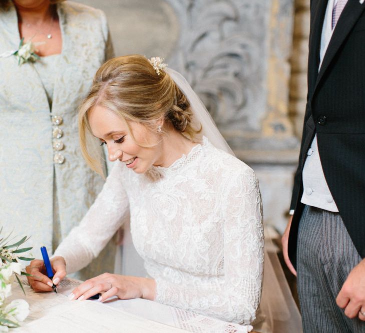 Papakata Sperry Tent Wedding at family home | Sassi Holford Dress with added ivory Ostrich feathers to veil | Manolo Blahnik shoes | Images by Melissa Beattie