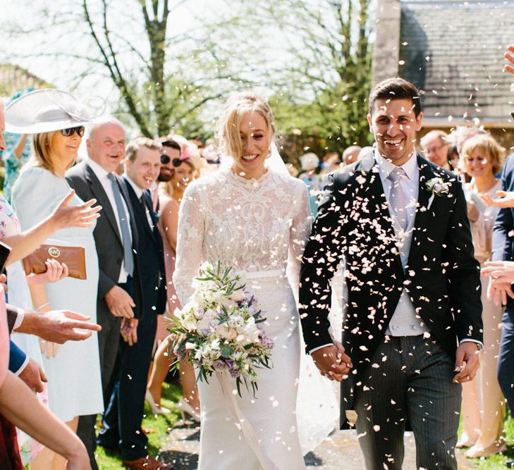 Confetti | Papakata Sperry Tent Wedding at family home | Sassi Holford Dress with added ivory Ostrich feathers to veil | Manolo Blahnik shoes | Images by Melissa Beattie